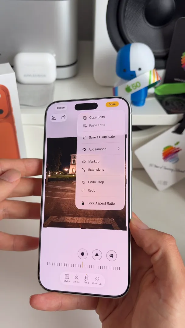 Dropdown menu in the Photos app editor showing the Save as Duplicate option highlighted