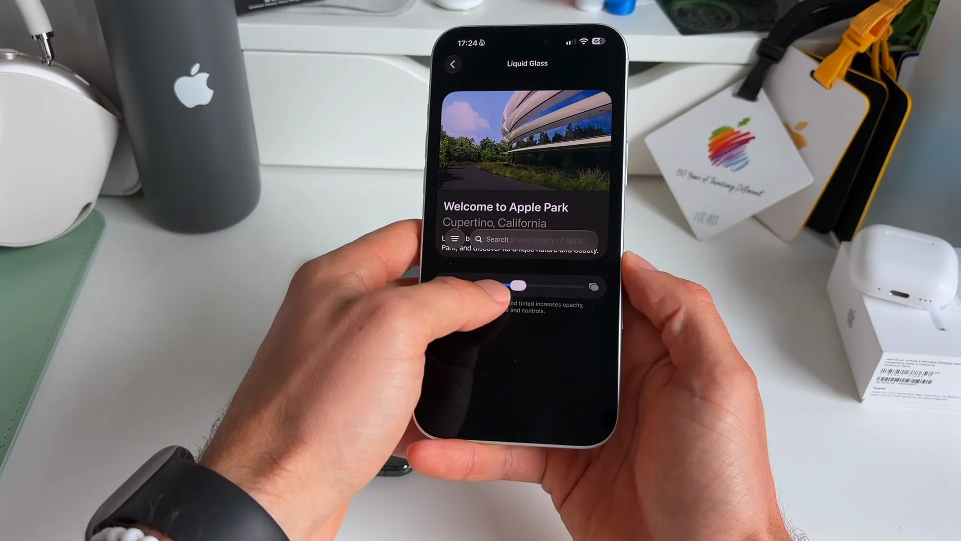 Settings screen showing the Liquid Glass intensity slider and a preview image of Apple Park