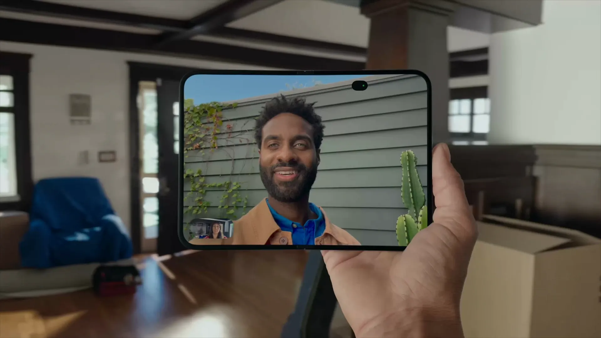 Man on a video call using the under-display inner selfie camera